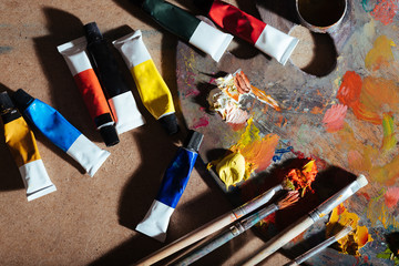 Top view of tubes with paint and palette