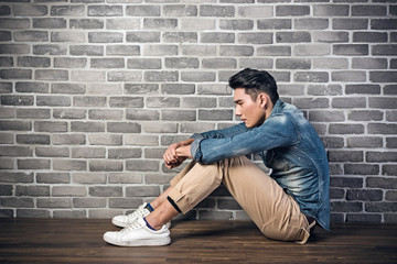 man sit on ground feel lonely
