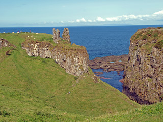 Fototapeta na wymiar Remaining remnants of Dunseverrick Castle on the coastline of County Antrim in Northern Ireland