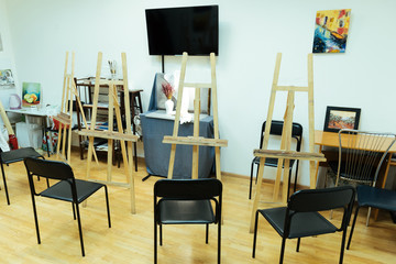Painting studio with easels standing in it