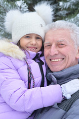 Obraz premium grandfather with granddaughter smiling