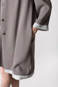 Details of women's clothing. Detail dress on a model on a white background