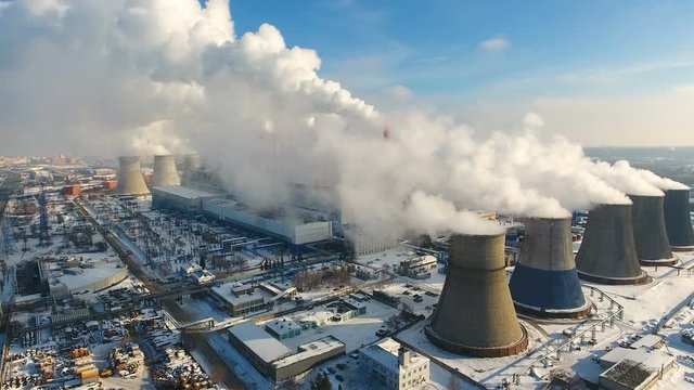 Smoke and steam from industrial power plant. Contamination, pollution, global warming concept. 4K.