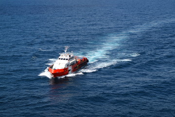 Naklejka premium Supply boat transfer cargo to oil and gas industry