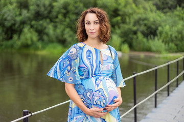 Pregnant woman on the bridge.