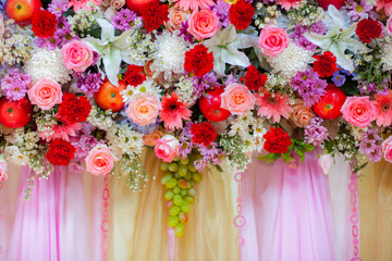beautiful colorful fresh flower decorate on background in weeding