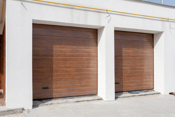 Double brown garage door in a new house