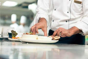 Indian Chef Arranging A Dish