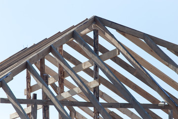 Obraz premium Wooden roof frame on a construction site
