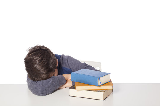 child sleeps on the books