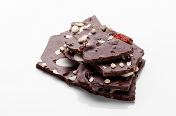 Closeup detail of chocolate parts on white background.