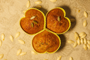Homemade pumpkin muffins in the shape of heart