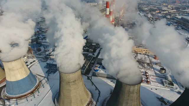 Smoke and steam from industrial power plant. Contamination, pollution, global warming concept. 4K.