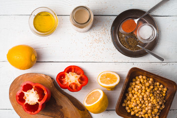 Fototapeta na wymiar Ingredients for hummus preparation ob the white wooden table horizontal