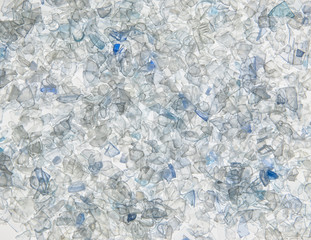 background of the pieces of plastic bottles white and grey colored. sliced pieces PET of bottles
