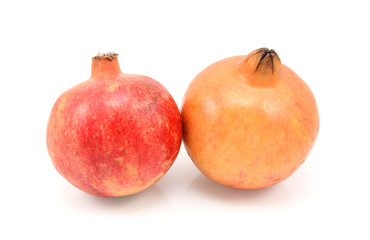 Two pomegranates, red and yellow
