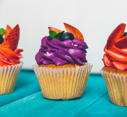 cupcakes on a blue vintage wooden background
