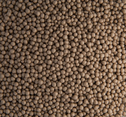 background of small plastic pellets brown colored