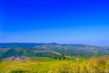 Fototapeta premium Terrain of highland and mountain in Phutubberk highlands with blue sky background in winter at Phetchabun District, Thailand.