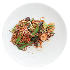 Buckwheat noodles with vegetables and mushrooms isolated on whit