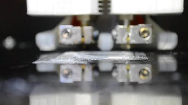 Building on new 3d printer printing isolated object white on clean flat surface. Modern technology prototyping of plastic, other material. Printing with Plastic Wire Filament on 3D Printer