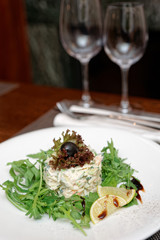 Seafood appetizer with rocket salad
