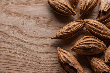 Almonds in shell on wooden table