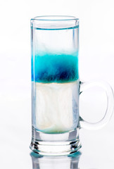 shots of colored layers of different alcohol