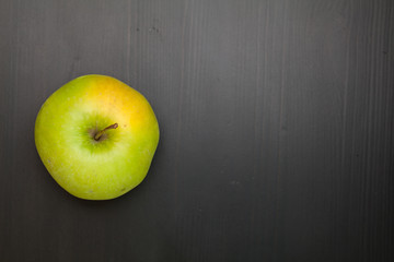  apple on a wooden background. Top view.