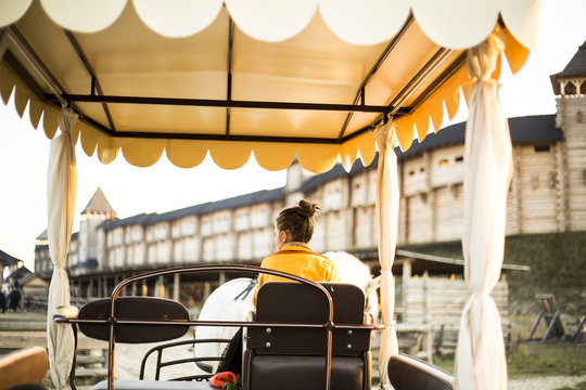 gharry for tourists with a yellow awning and horse harnessed. excursion
