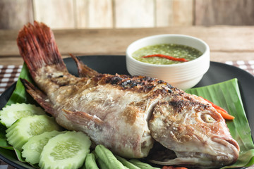 Grilled Fish and Thai Sauce on table.