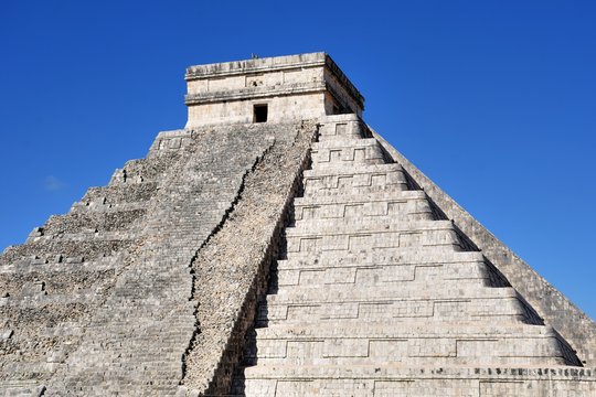 Temple at Chichen Itza Mexico with one half resored