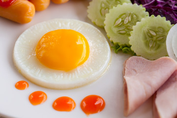 American breakfast set and orange juice on white dish