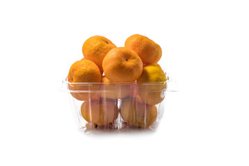 The pile of fresh oranges in the plastic basket isolated on white background