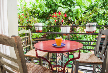 A cup of coffee on table, mediterranean style. Vacation concept
