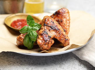Delicious crispy chicken wings with sauce and beer