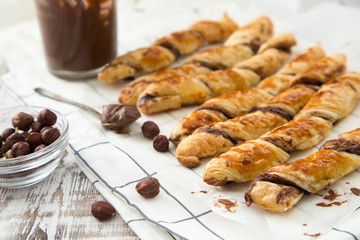 homemade cakes - puff pastry with chocolate paste. twisted cakes