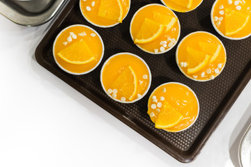 Orange cupcakes in blue baking cup, select focus.
