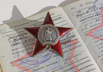 Order "The Red Star" on the background of military ID