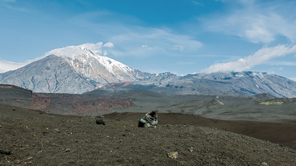 Volcano Ostry Tolbachik and Plosky Tolbachic (volcanic bomb in the foreground) - Kamchatka, Russia