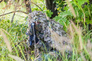 a military man in an ambush in the forest