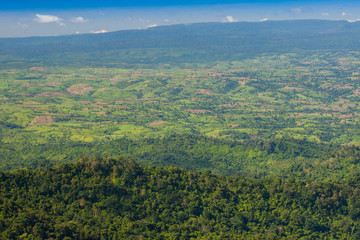 Green of land a mountain landscape with foggy background