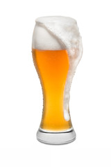 Isolated Wheat Beer, with Overflowing Foam Running Down Side