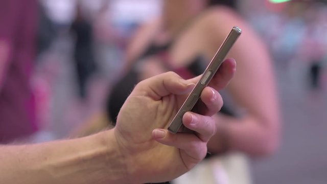 CLOSE UP: Unrecognizable man writing messages using swype on his smart phone