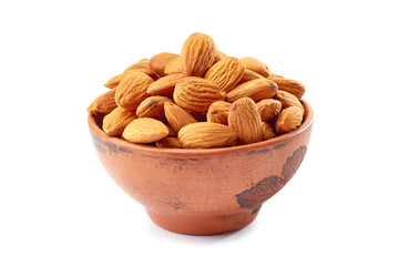 Peeling almond in ceramic bowl on white