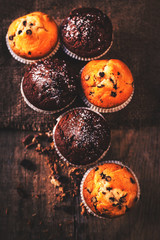 .Chocolate muffins on wooden  table, homemade bakery, close up i