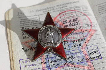Order "The Red Star" on the background of military ID
