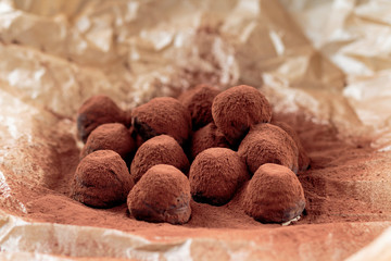 Chocolate truffles filled with caramelized hazelnut chips and cowered with cocoa powder