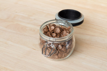 Chocolate cereal cornflakes in the glass jar