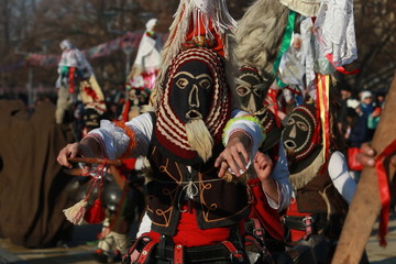 Fototapeta na wymiar Pernik, Bulgaria - January 28, 2017: Masquerade festival Surva in Pernik, Bulgaria. People with mask called Kukeri dance and perform to scare the evil spirits.